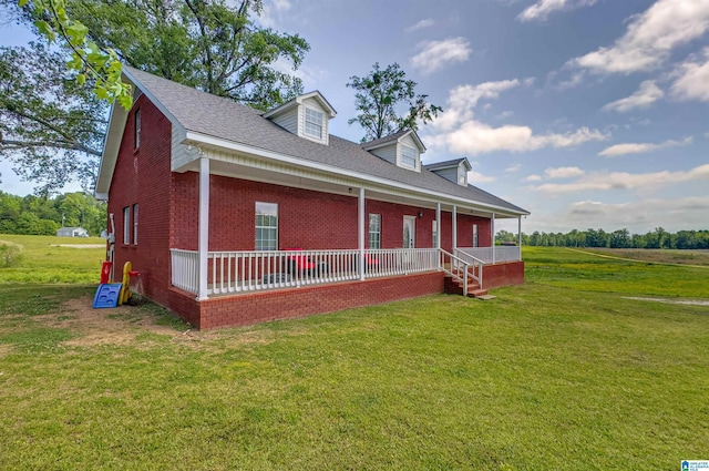 exterior space featuring covered porch, brick siding, roof with shingles, and a front lawn