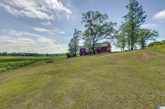 view of yard featuring a rural view and a barn