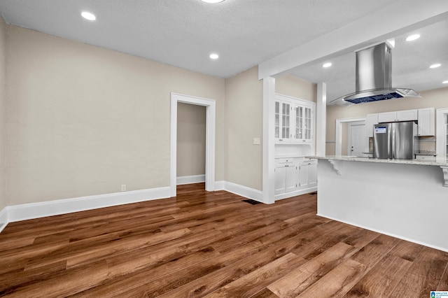 1330 Bush Blvd W, Birmingham, AL 35208 - unfurnished living room with wood finished floors, recessed lighting, and baseboards