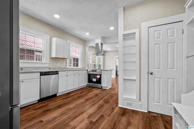 1330 Bush Blvd W, Birmingham, AL 35208 - kitchen featuring appliances with stainless steel finishes, island exhaust hood, white cabinets, dark wood-type flooring, and recessed lighting