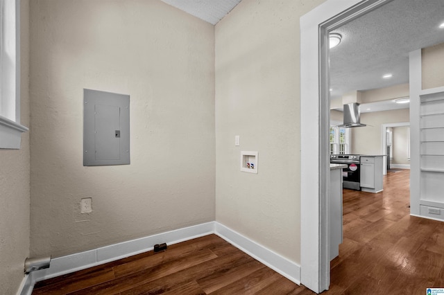 1330 Bush Blvd W, Birmingham, AL 35208 - laundry room with electric panel, hookup for a washing machine, wood finished floors, and baseboards