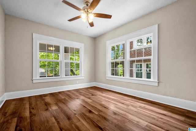 1330 Bush Blvd W, Birmingham, AL 35208 - spare room with wood finished floors, baseboards, and ceiling fan