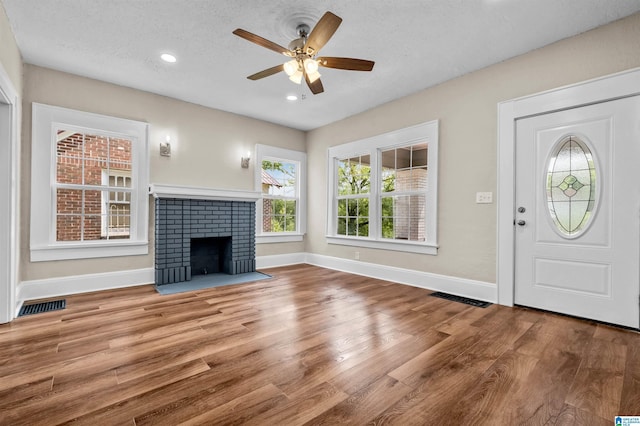 1330 Bush Blvd W, Birmingham, AL 35208 - unfurnished living room with plenty of natural light, ceiling fan, baseboards, wood finished floors, and recessed lighting