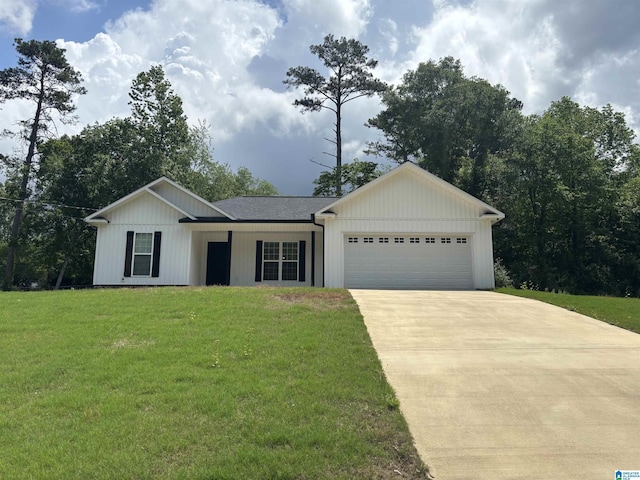 ranch-style home with a front lawn, driveway, and a garage