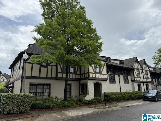 2257 Acton Park Cir, Birmingham, AL 35243 - view of front of house featuring stucco siding, a shingled roof, and brick siding
