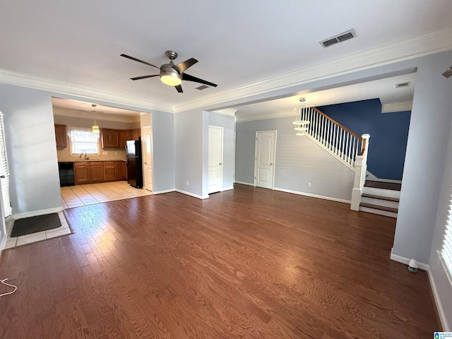 2257 Acton Park Cir, Birmingham, AL 35243 - unfurnished living room featuring a ceiling fan, crown molding, wood finished floors, stairway, and baseboards