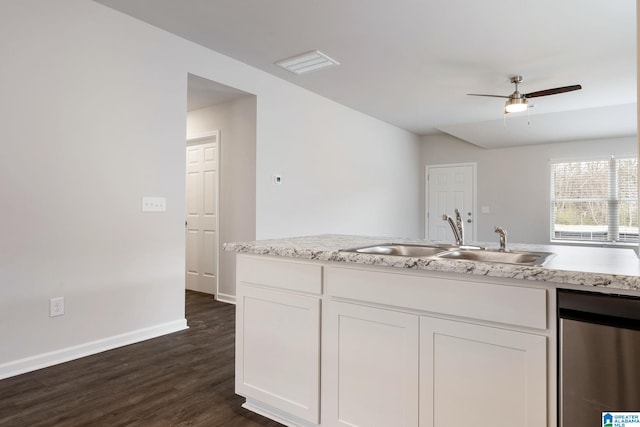 kitchen featuring white cabinetry, ceiling fan, a sink, and dark wood-type flooring
