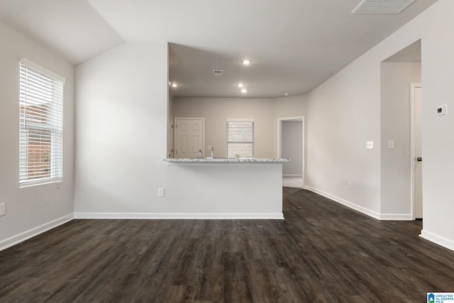 empty room featuring baseboards, recessed lighting, visible vents, and dark wood-type flooring