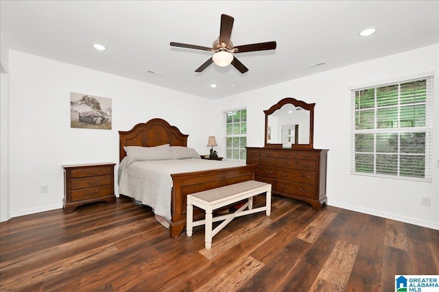 bedroom with dark wood-style flooring, visible vents, and recessed lighting