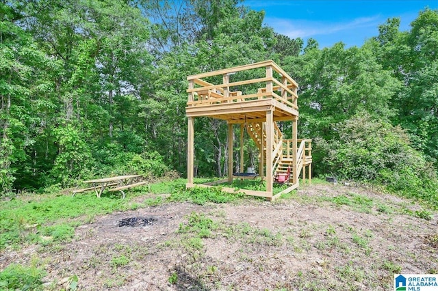 view of yard with stairway and a wooden deck