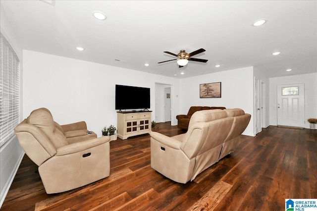 living room featuring baseboards, dark wood-style flooring, a ceiling fan, and recessed lighting