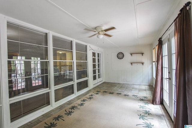 unfurnished sunroom with french doors