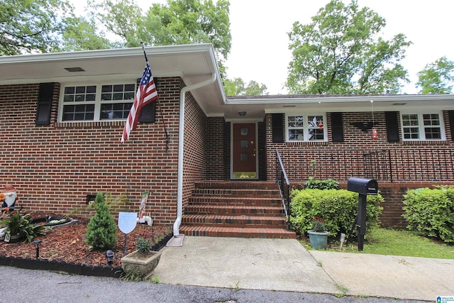 entrance to property with brick siding