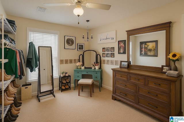 sitting room with light colored carpet, baseboards, a ceiling fan, and visible vents