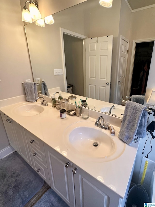 971 Old Cahaba Dr, Helena, AL 35080 - bathroom with double vanity, a closet, and ornamental molding