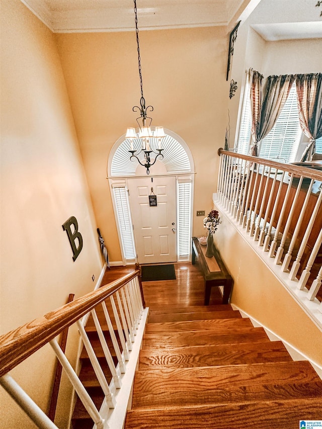 971 Old Cahaba Dr, Helena, AL 35080 - entrance foyer with ornamental molding, stairs, wood finished floors, a chandelier, and baseboards