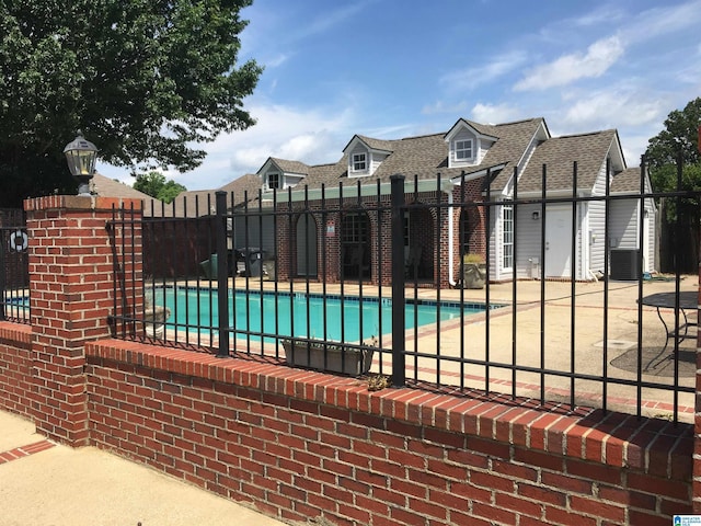 1037 Windsor Pkwy, Moody, AL 35004 - community pool with a patio area and cooling unit