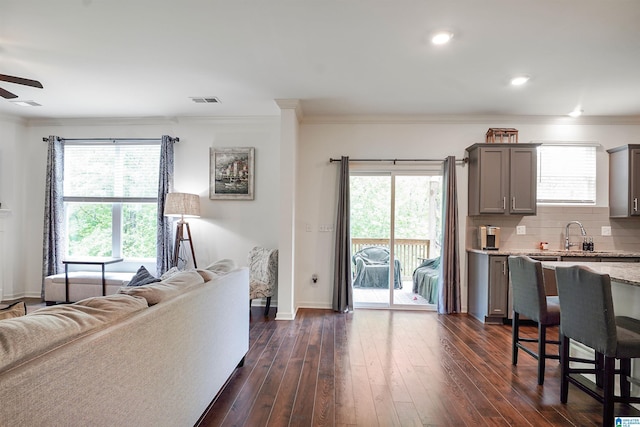 1064 Timberline Rdg, Calera, AL 35040 - living room with a ceiling fan, ornamental molding, visible vents, and baseboards