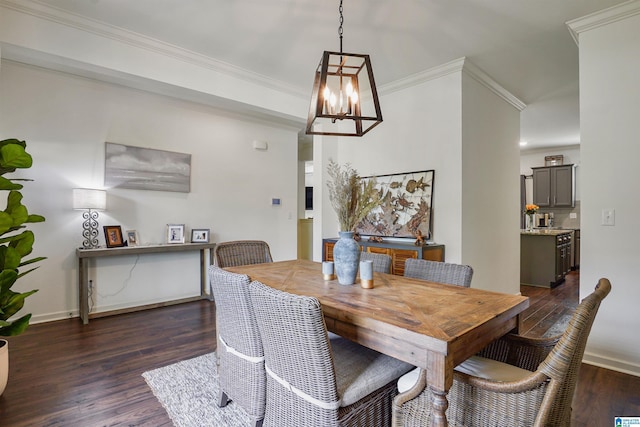 1064 Timberline Rdg, Calera, AL 35040 - dining space with baseboards, a notable chandelier, crown molding, and dark wood-type flooring