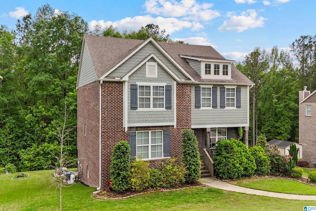 1064 Timberline Rdg, Calera, AL 35040 - view of front of property with a front yard, brick siding, and a shingled roof