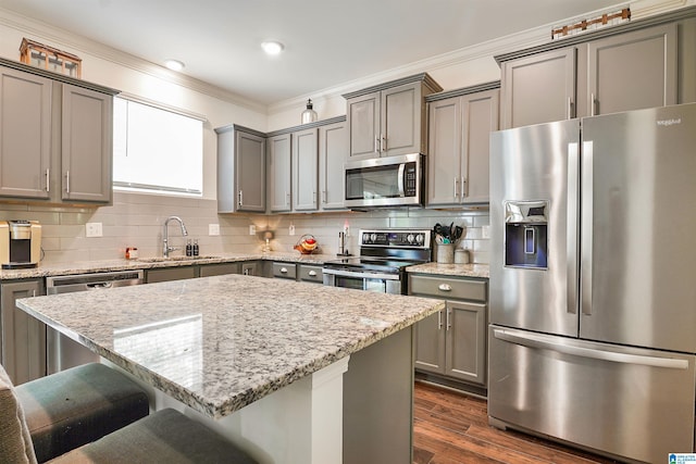 1064 Timberline Rdg, Calera, AL 35040 - kitchen featuring gray cabinetry, stainless steel appliances, ornamental molding, and a sink