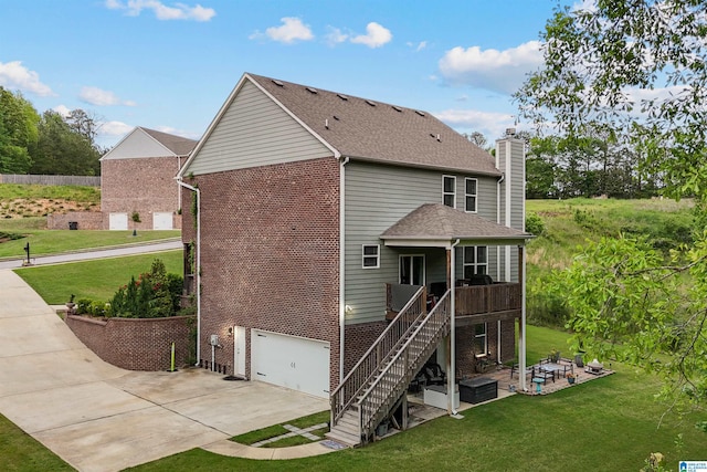 1064 Timberline Rdg, Calera, AL 35040 - rear view of property featuring brick siding, driveway, a chimney, and a lawn