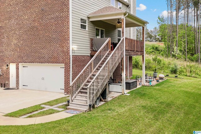 1064 Timberline Rdg, Calera, AL 35040 - back of house with stairs, driveway, a garage, a ceiling fan, and a lawn