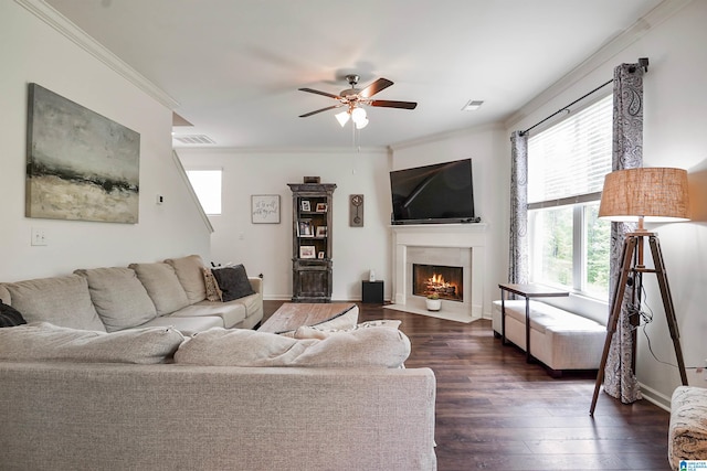1064 Timberline Rdg, Calera, AL 35040 - living area featuring a fireplace with flush hearth, ornamental molding, a ceiling fan, and visible vents