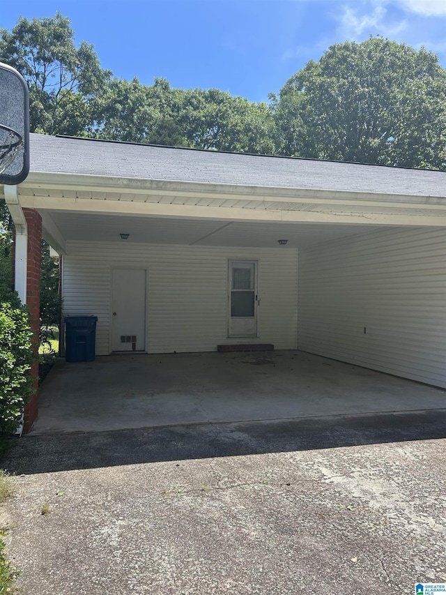 view of parking with an attached carport