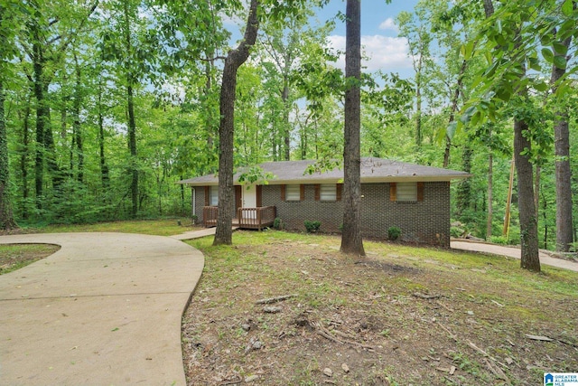 711 Oak Ridge Dr, Birmingham, AL 35214 - ranch-style home with a wooden deck, brick siding, and driveway