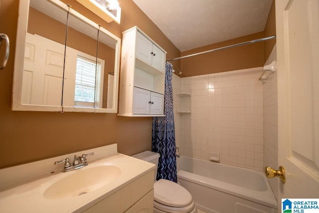 1009 Maxanna Dr, Anniston, AL 36206 - full bathroom featuring vanity, shower / bath combo, and a textured ceiling