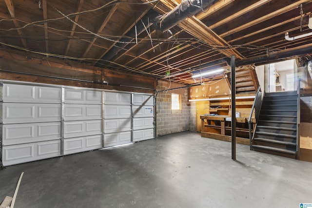 garage with concrete block wall