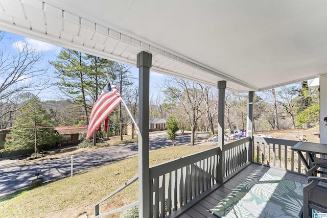 wooden terrace with a porch