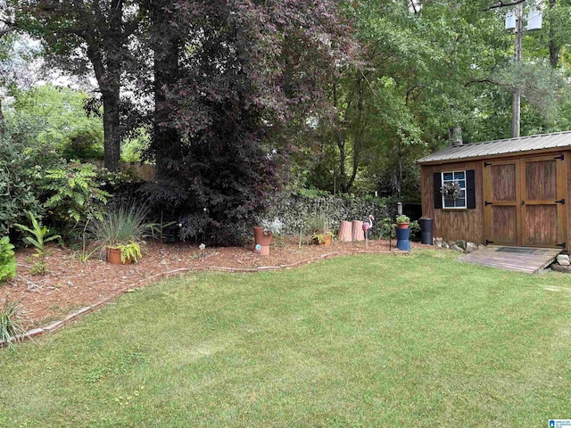 view of yard with an outbuilding and a storage shed