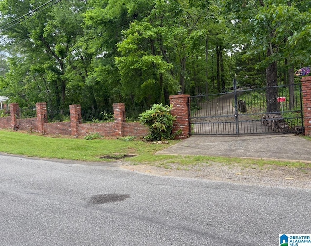 view of gate featuring fence