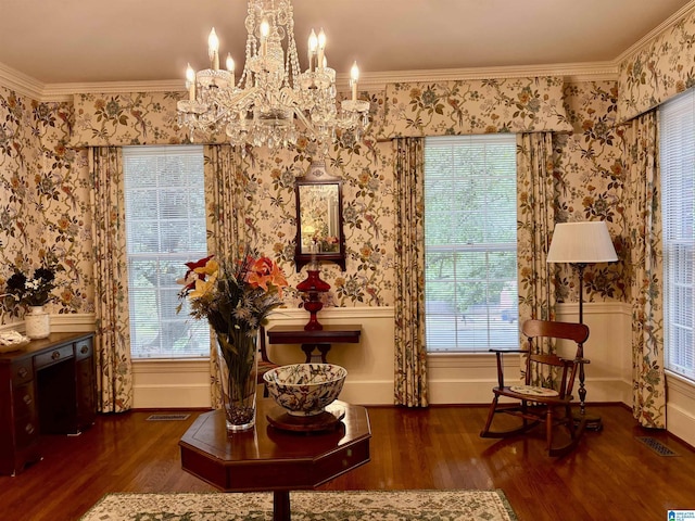 living area with wainscoting, a chandelier, wallpapered walls, and wood finished floors
