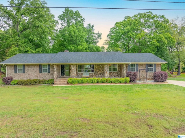 1111 Creek Trl, Anniston, AL 36206 - single story home featuring a chimney, a front yard, a porch, and brick siding