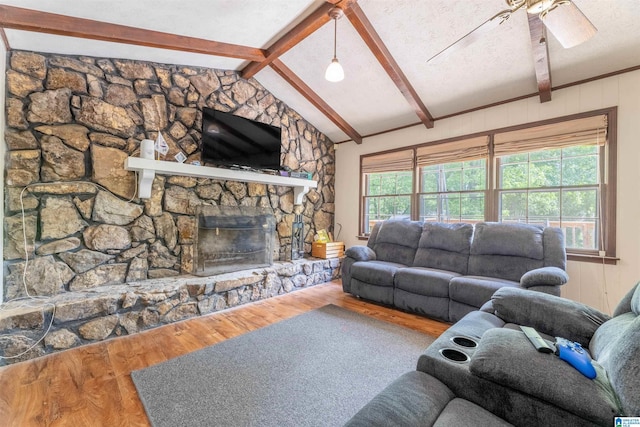 1111 Creek Trl, Anniston, AL 36206 - living room featuring ceiling fan, wood finished floors, plenty of natural light, and vaulted ceiling with beams