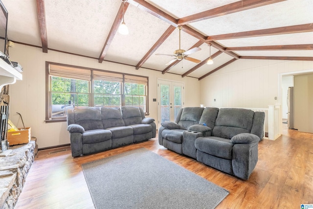 1111 Creek Trl, Anniston, AL 36206 - living room featuring a ceiling fan, lofted ceiling with beams, french doors, and wood finished floors