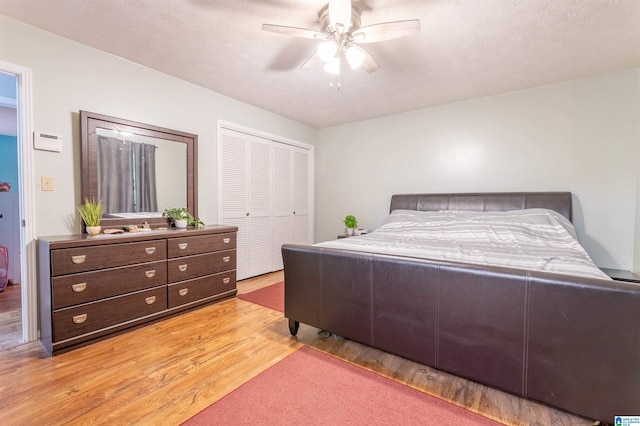 1111 Creek Trl, Anniston, AL 36206 - bedroom with a closet, light wood-type flooring, and a ceiling fan