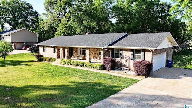 1111 Creek Trl, Anniston, AL 36206 - single story home with a porch, an attached garage, brick siding, driveway, and a front yard