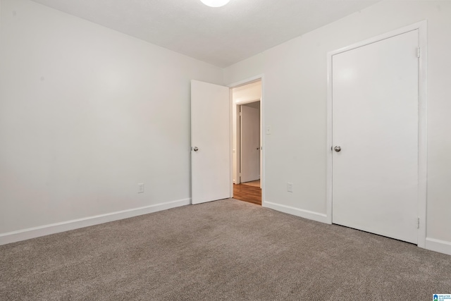 816 8th Cir N, Pell City, AL 35125 - unfurnished bedroom with carpet flooring and baseboards