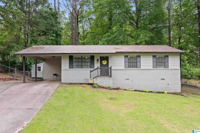 816 8th Cir N, Pell City, AL 35125 - view of front of property featuring brick siding, driveway, a carport, and metal roof