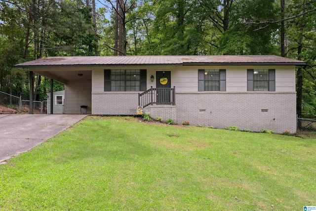 816 8th Cir N, Pell City, AL 35125 - view of front of property featuring driveway, brick siding, a carport, and metal roof