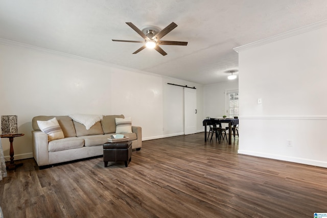 816 8th Cir N, Pell City, AL 35125 - living area featuring a barn door, a ceiling fan, dark wood-style floors, crown molding, and baseboards