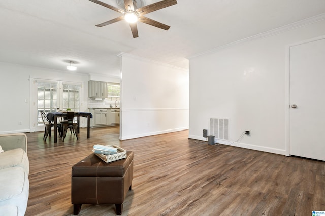 816 8th Cir N, Pell City, AL 35125 - living area with crown molding, a ceiling fan, wood finished floors, and baseboards