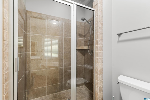 full bathroom featuring toilet and a stall shower