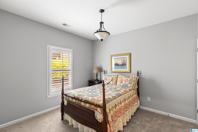 carpeted bedroom with baseboards