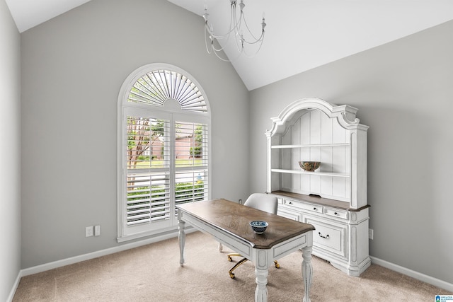 office with vaulted ceiling, light colored carpet, and baseboards