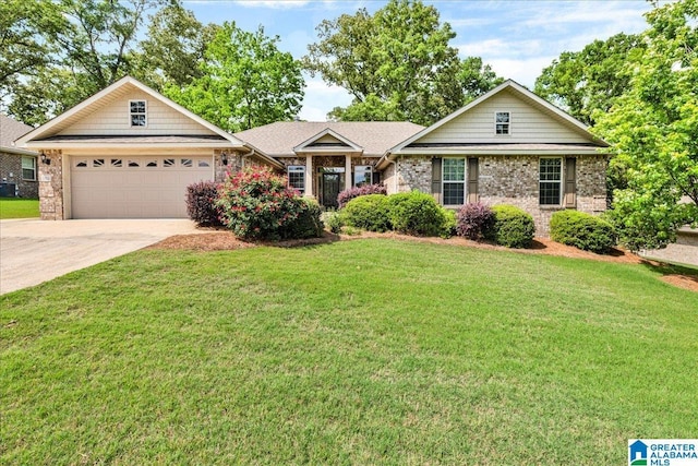 1004 Hidden Forest Dr, Montevallo, AL 35115 - view of front of house with an attached garage, stone siding, a front lawn, brick siding, and driveway